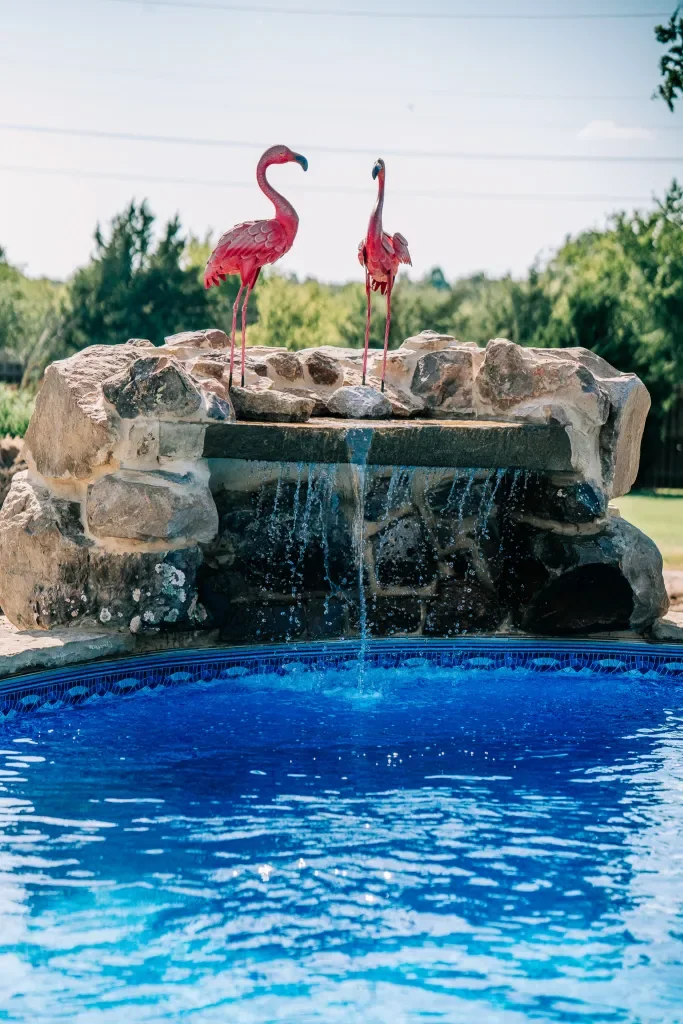 Stone grotto waterfall feature on a completed pool